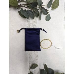 Tory Burch Eleanor Hinged Cuff Bracelet in Rolled Brass Gold